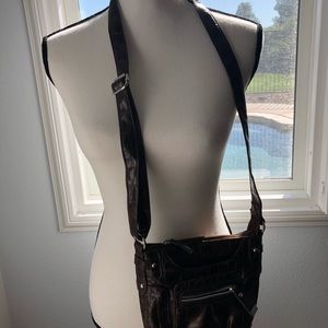 Brown crocodile print crossover purse.